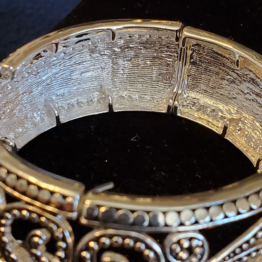 Fashion Leader silvertone scroll stretch bangle bracelet
